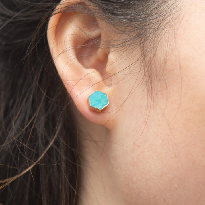 Model photo of woman with turquoise stone and gold jewelry, sustainable fair trade artisan jewelry, present for xmas, jewelry website