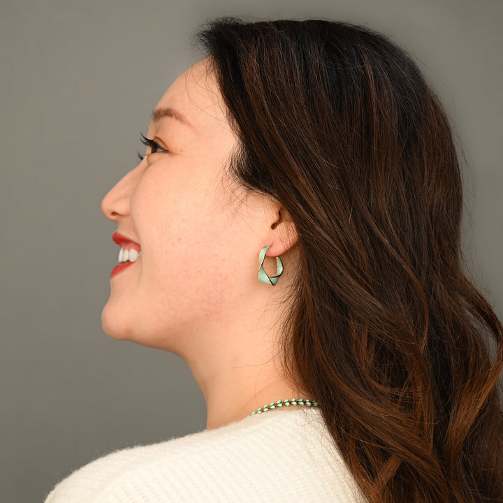 Model wearing mint hoops, twist hoops, green earrings, gold and mint jewelry, best xmas gift ideas, Mother's day present