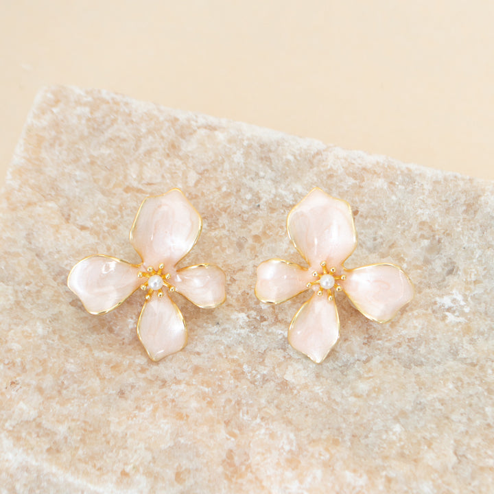 Marble background with rose gold studs, women's earrings, gold and rose gold jewelry, jewelry shops, jewelry website