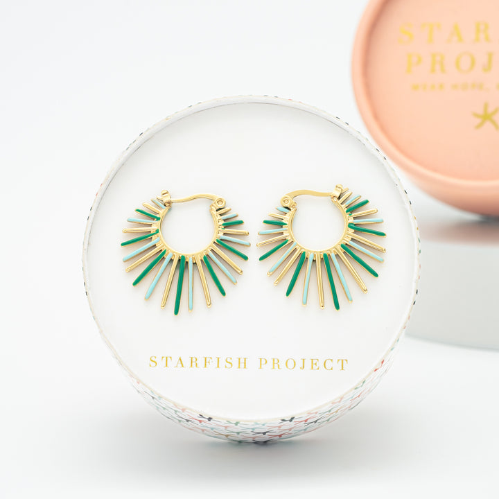 Sun-shaped earrings, Starfish Project brand gift box, gold hoops, green goops, sun-shaped jewelry, stores like pandora