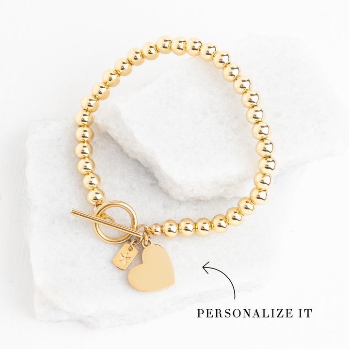 Photo of gold engravable bracelet, bracelet with heart, beaded bracelet, engravable jewelry for women, heart attachment