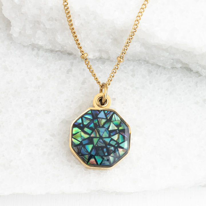 Photo of gold necklace with abalone, locket, shell necklace, gold and green jewelry, jewelry shops, fair trade quality jewelry