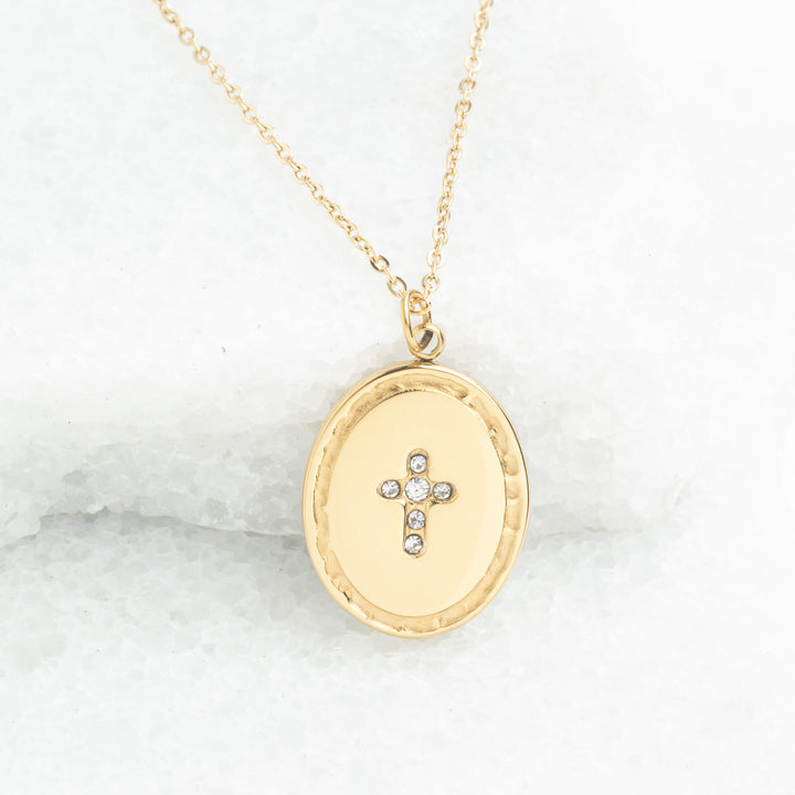 Women's jewelry, 14k plated Gold necklace with a cross pendant on a marble surface, symbol of hope, jewelry design, best xmas gift