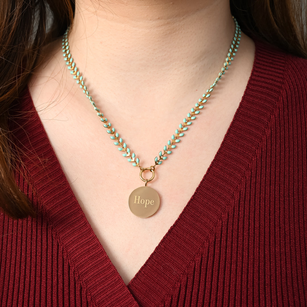 Woman wearing engraved necklace, necklaces with a message, jewelry website, mint seed chain