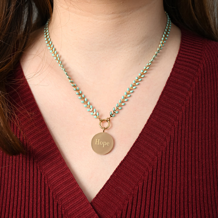 Woman wearing engraved necklace, necklaces with a message, jewelry website, mint seed chain
