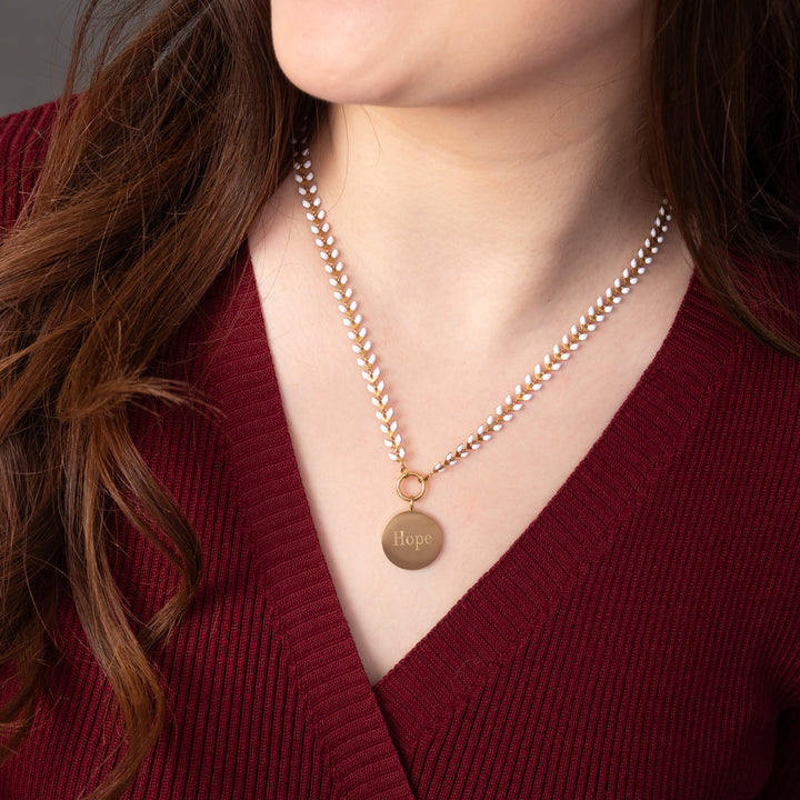 Woman wearing engraved necklace, necklaces with a message, jewelry website, ivory seed chain