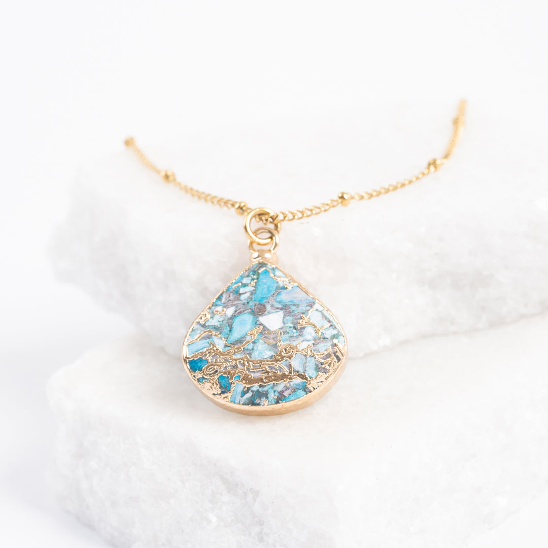 Photo of stunning emperor stone pendant necklace, gold chain necklace, shades of gold pendant, fair trade gold jewelry, jewelry store, jewelry presents