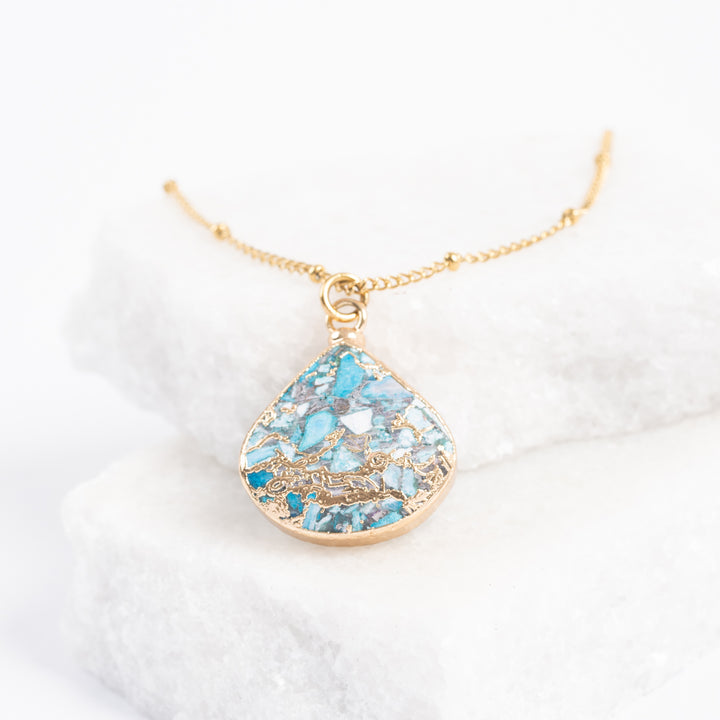 Photo of stunning emperor stone pendant necklace, gold chain necklace, shades of gold pendant, fair trade gold jewelry, jewelry store, jewelry presents