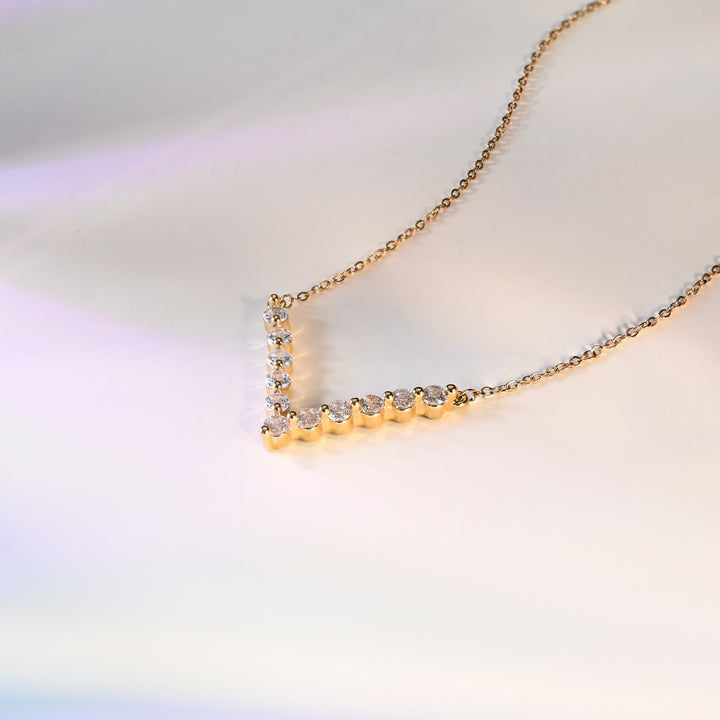 Close up photo of gold quality wedding day necklace, fair trade jewelry market, artisan women's jewelry