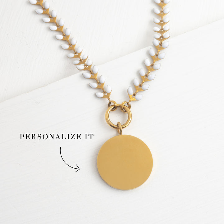 Photo of gold engravable necklace, necklace with heart center, heart pendant necklace, engravable jewelry for women, gold seed-shaped chain