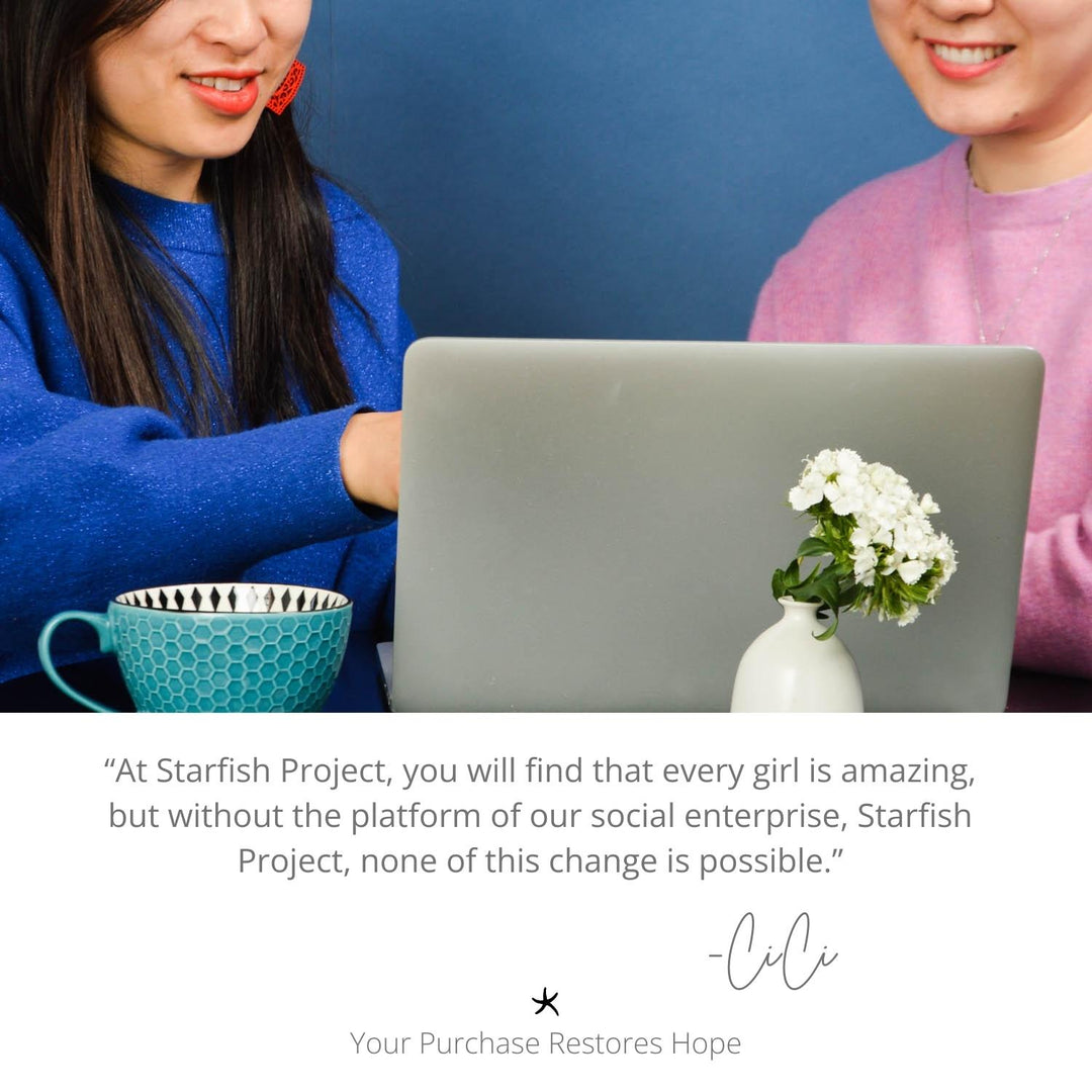 Two women looking at laptop while working, freedom trading company, handcrafted jewelry, hope, symbolism of hope, career development, women's jewelry