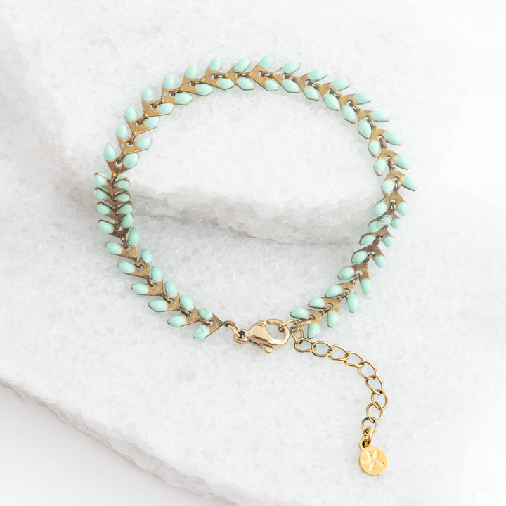 Picture of gold bracelet with mint colored seeds, seed-shaped bracelet, gold bracelets for women, sustainable fair trade jewelry