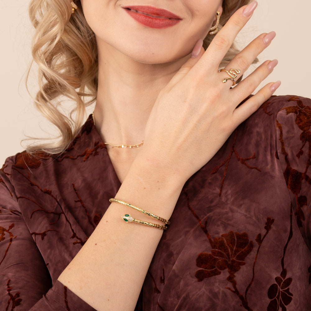 Woman wearing gold snake-shaped jewelry set, unique gift ideas, special christmas present, jewelry shop, cute gold jewelry