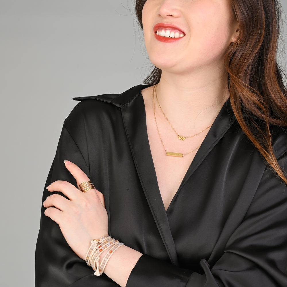A woman modeling gold necklaces, layered gold necklaces, xmas present ideas, fashion jewelry