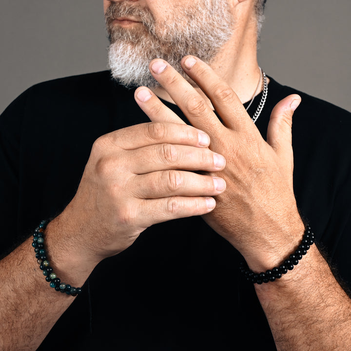 Photo of a man wearing beaded bracelets, black beaded bracelets for men, online gift shopping, jewelry store near me