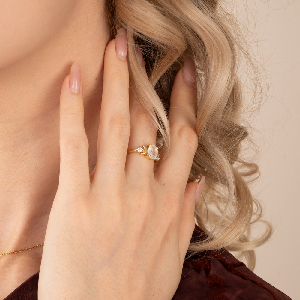 Woman wearing beautiful gold plated ring with moonstone center, jewelry stores, gold rings, jewelry shop, beautiful christmas gifts