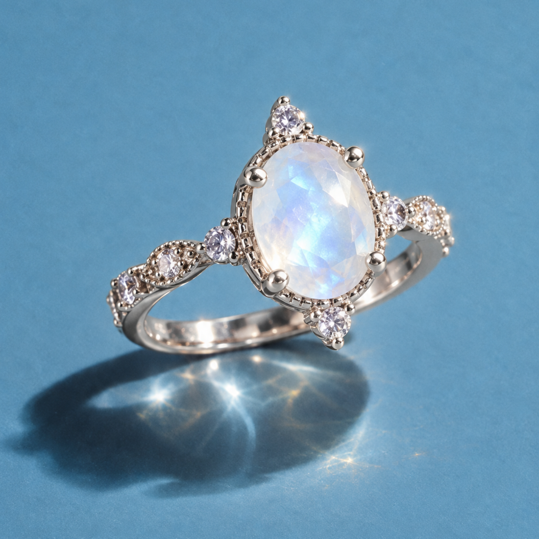 Lunar Crest Moonstone Ring in white gold-plated brass with an oval natural moonstone and clear accent stones