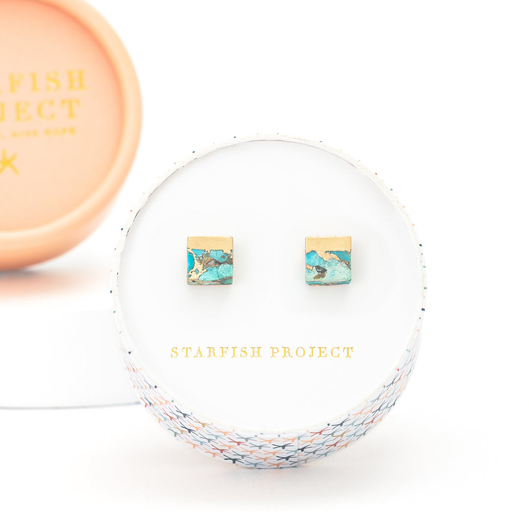 Set of turquoise and gold women's fair trade jewelry gift in a round box with the logo of Fair trade gift companies, Starfish Project