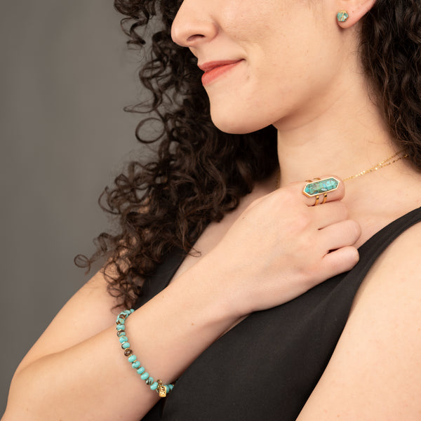 Woman wearing beautiful turquoise ring with matching bracelet, turquoise jewelry for women