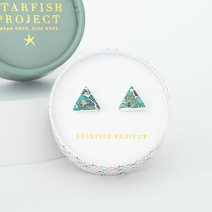 A set of turquoise and silver women's earrings gift in a round box with fair trade gift company logo, Starfish Project, jewelry website, Mother's day presents, Christmas present, silver studs for women