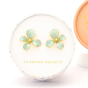 Gift box holding flower shaped earrings, symbolism for hope, jewelry with purpose, Starfish Project, jewelry brands like pandora, mother's day gift