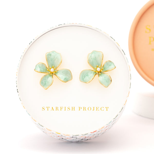 Gift box holding flower shaped earrings, symbolism for hope, jewelry with purpose, Starfish Project, jewelry brands like pandora, mother's day gift
