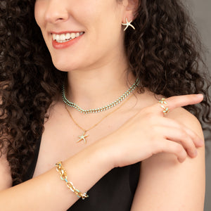 Woman wearing matching starfish themes jewelry set, mint green jewelry pieces, jewelry websites for women