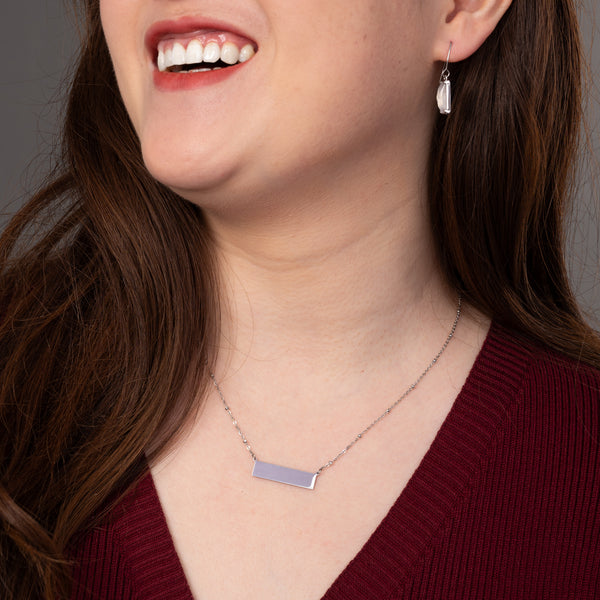 Woman wearing engravable necklace, necklaces with a message, jewelry website, silver bar necklace for women