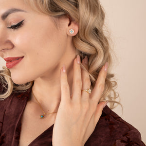 Model photo of woman with 18k gold plated earrings with zircon, best fair trade jewelry company, great christmas gift ideas
