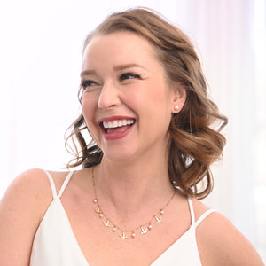 A bride wearing cute gold and pearl necklace, gold wedding necklaces, Macy's jewelry, high end jewelry brands