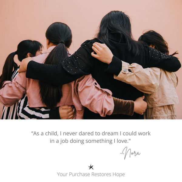 Photo of women hugging one another, Starfish Project, symbolism for hope, symbolism of starfish, hope restored, women's fair trade jewelry, jewelry company  