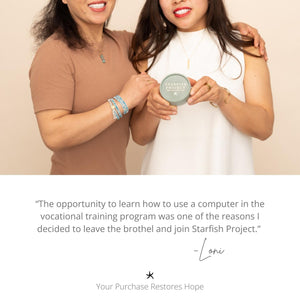 Photo of two women smiling while showing various quality jewelry pieces, golds and colorful women's jewelry, symbolism for hope, meaningful jewelry, jewelry website