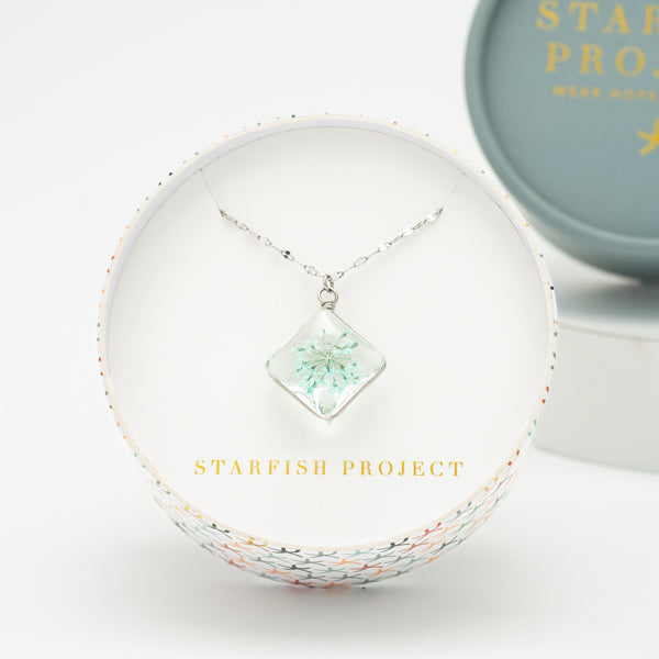 Gift box with silver flower necklace, fair trade gifting company, gift ideas for the holidays 