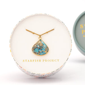 Picture of gold shaded and blue pendant, necklace, 14k gold plated stainless steel chain, jewelry gift shops, fair trade women's jewelry, white gift box, great xmas gift