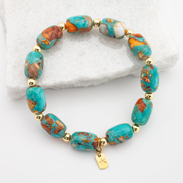 Photo of emperor stone bracelet, colorful  blue, orange, and white stones, gold starfish logo, jewelry gift store, womens bracelet