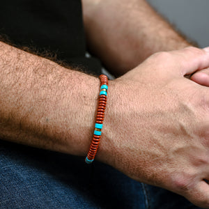 Photo of a man wearing beaded bracelet, red and blue beaded bracelet for men, ocean beaded bracelets for men
