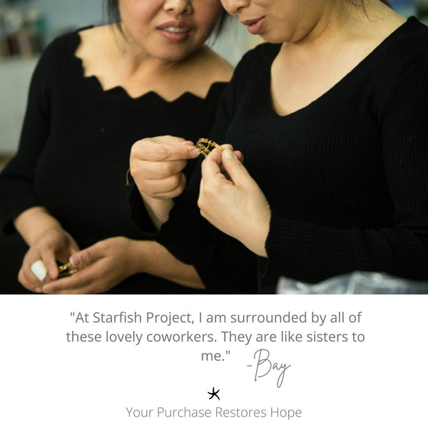 Photo of women admiring and creating a beautiful gold bracelet, handmade jewelry, Starfish Project symbolism, symbol of hope, fair trade artisan jewelry