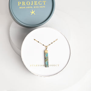 Necklace with gold shaded pendant in white gift box, Starfish Project, necklace company, jewelry web, unique xmas present ideas