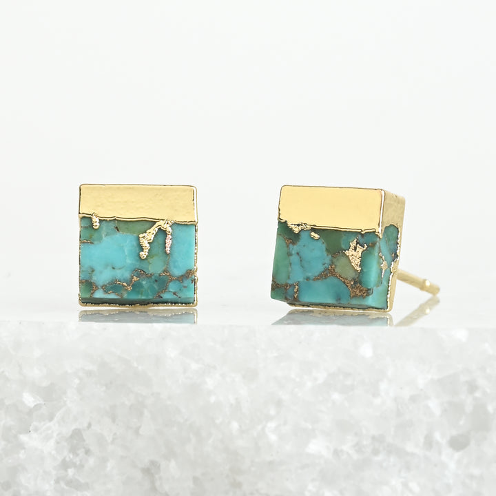A pair of 14k gold-plated studs, fair trade high quality cute earrings with unique turquoise stones set against a marble background. great Christmas present (Xmas gift), Mother's Day gift