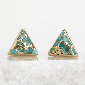 A pair of natural turquoise and 14k plated gold studs, sustainable fair trade jewelry, women's jewelry, beautiful and quality earrings set against a marble background. Great Christmas present (unique xmas gift), present for Mother's day 