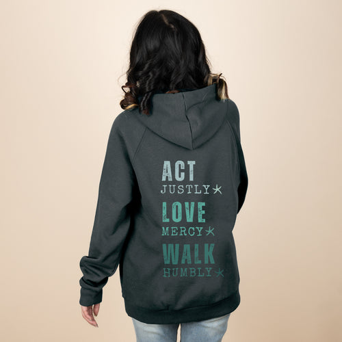 Back of woman wearing charcoal Love Mercy hoodie with Act Justly Love Mercy Walk Humbly print