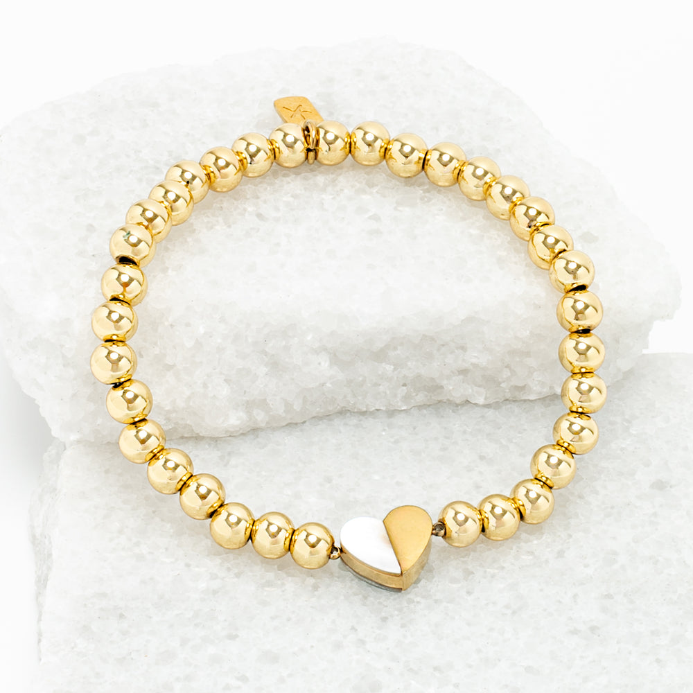 Photo of gold beaded bracelet, gold heart pendant, 18k gold brass beads, symbol of hope, jewelry company like pandora