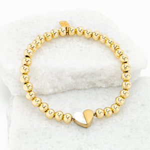 Photo of gold beaded bracelet, gold heart pendant, 18k gold brass beads, symbol of hope, jewelry company like pandora