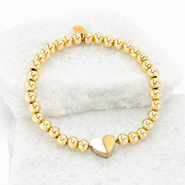 Photo of gold beaded bracelet, gold heart pendant, 18k gold brass beads, symbol of hope, jewelry company like pandora